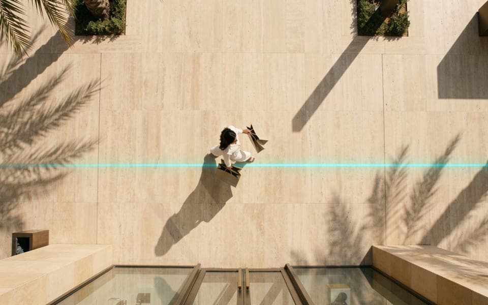 A Blicq navigation path guiding a visitor across a venue, seen from above